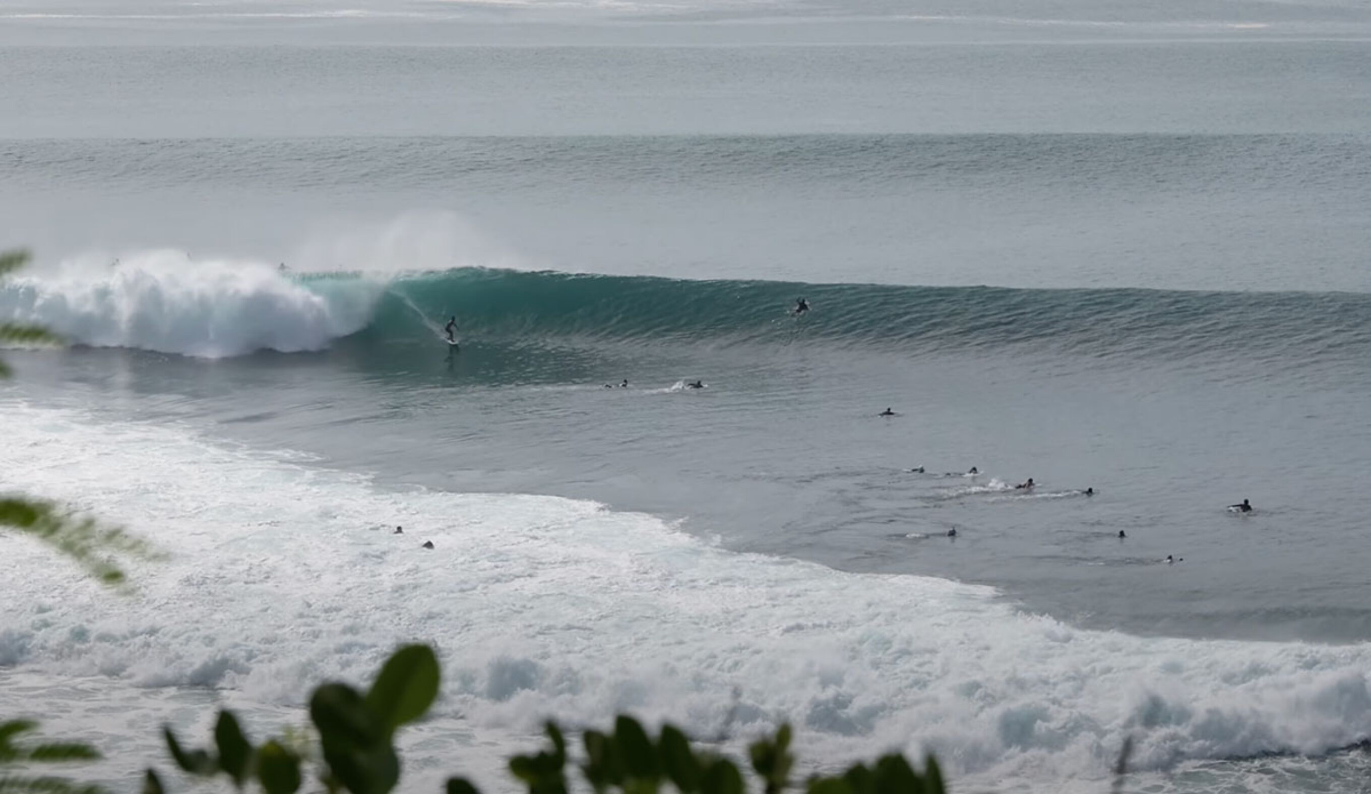 Padang Padang waves with surfers on them