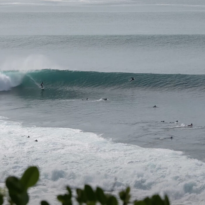 Padang Padang waves with surfers on them