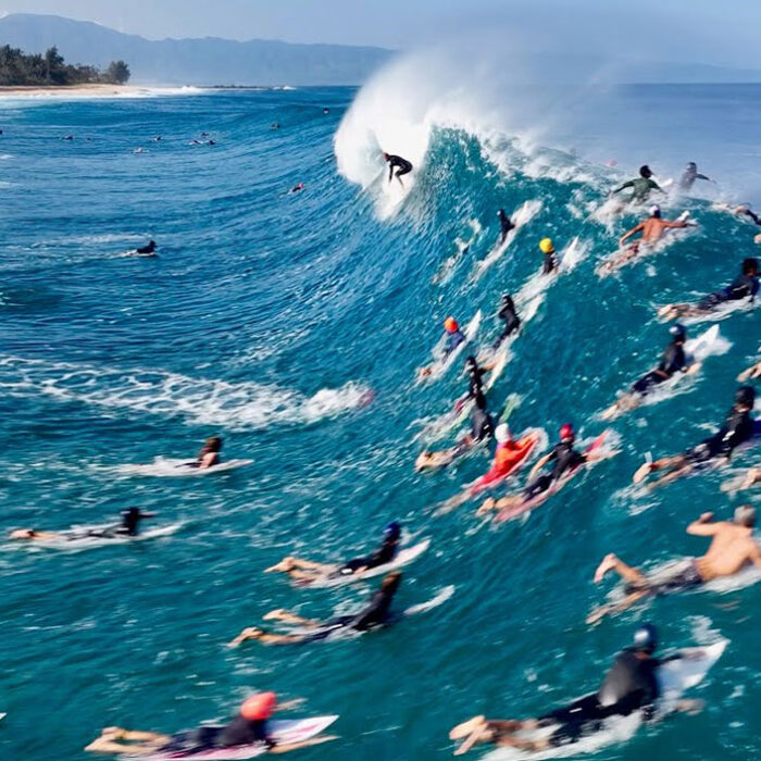 Surfers with Jamie O'Brien in the lineup at Pipeline