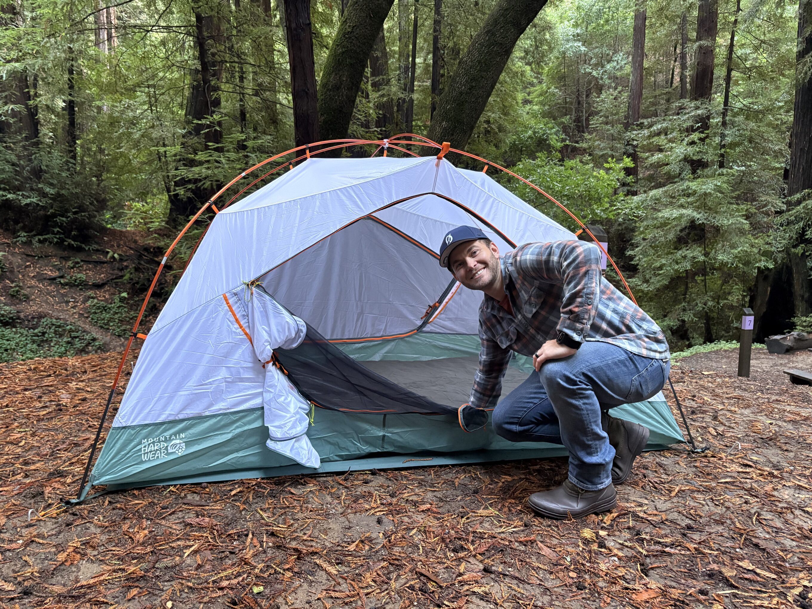 a man in front of a tent
