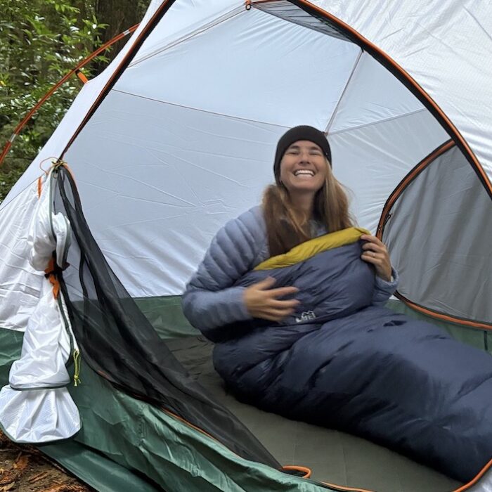 a woman in a sleeping bag