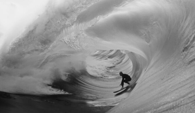 Russell Bierke surfing on a big wave