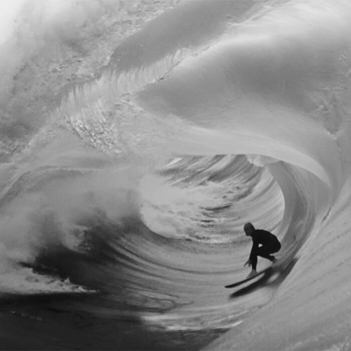 Russell Bierke surfing on a big wave