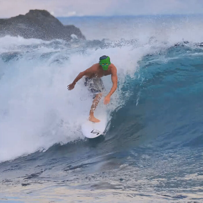 Clay Marzo surfing in a Frankenstein mask