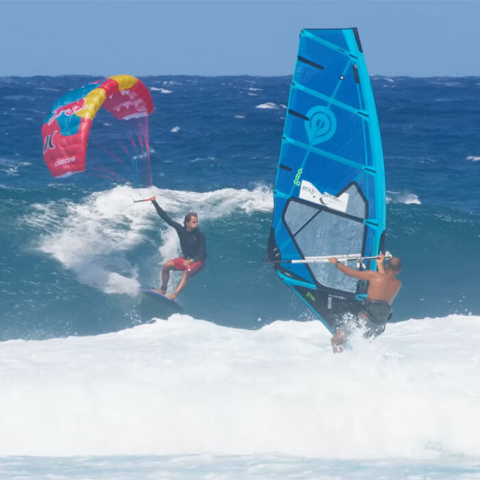 Kai Lenny surfing a longboard with a parawing at Hookipa