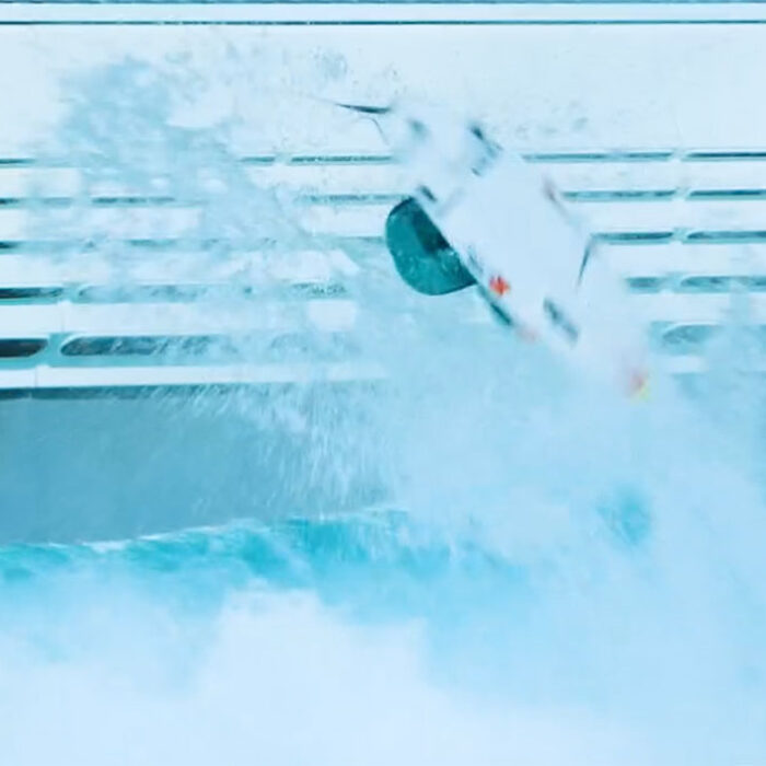 Sierra Kerr doing a backflip in a wave pool
