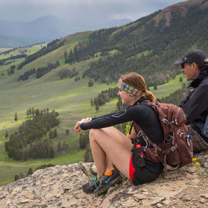 Foreign visitors sitting at Yellowstone National Park
