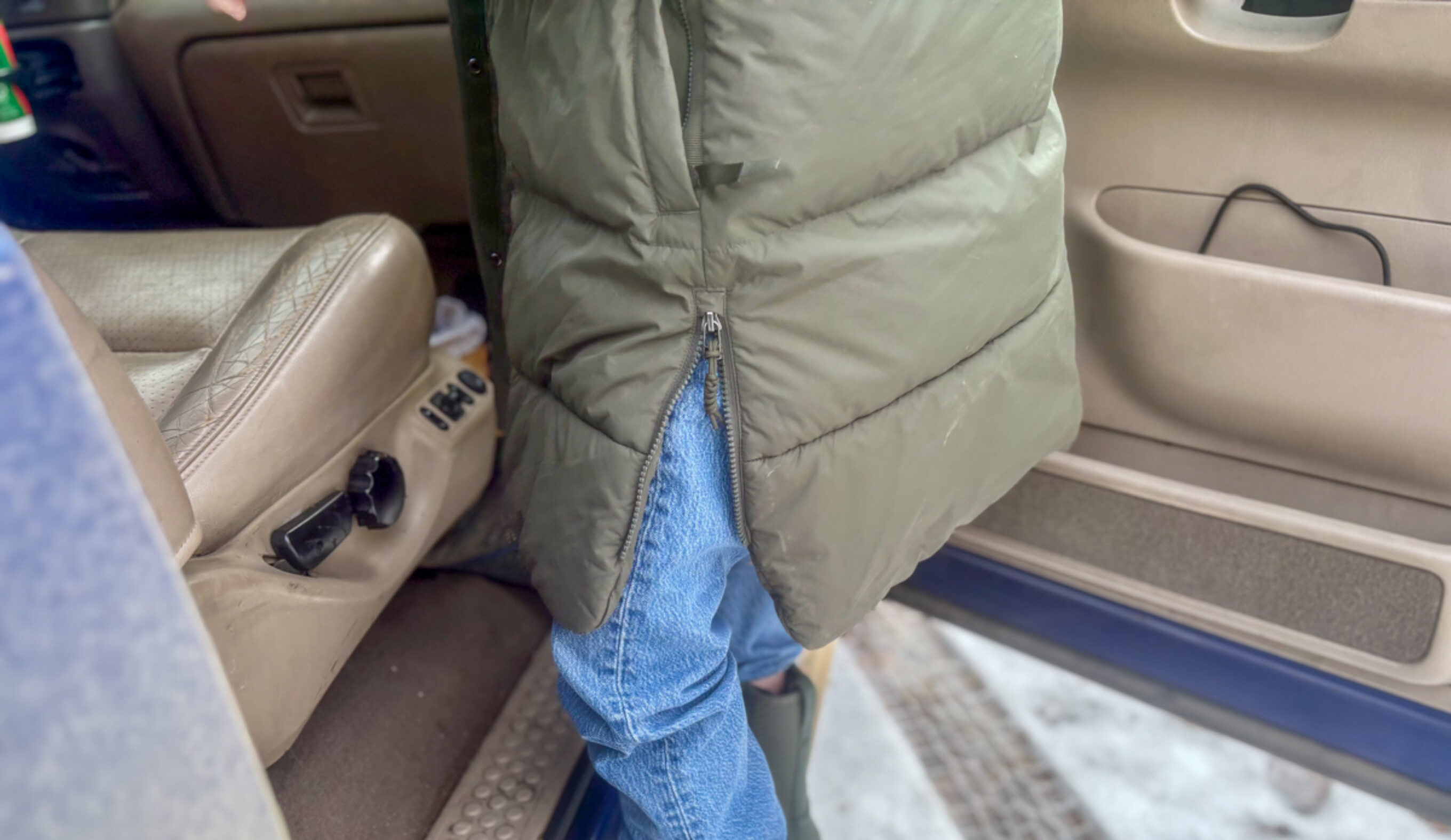 REI Campwell Down Parka side zip on truck