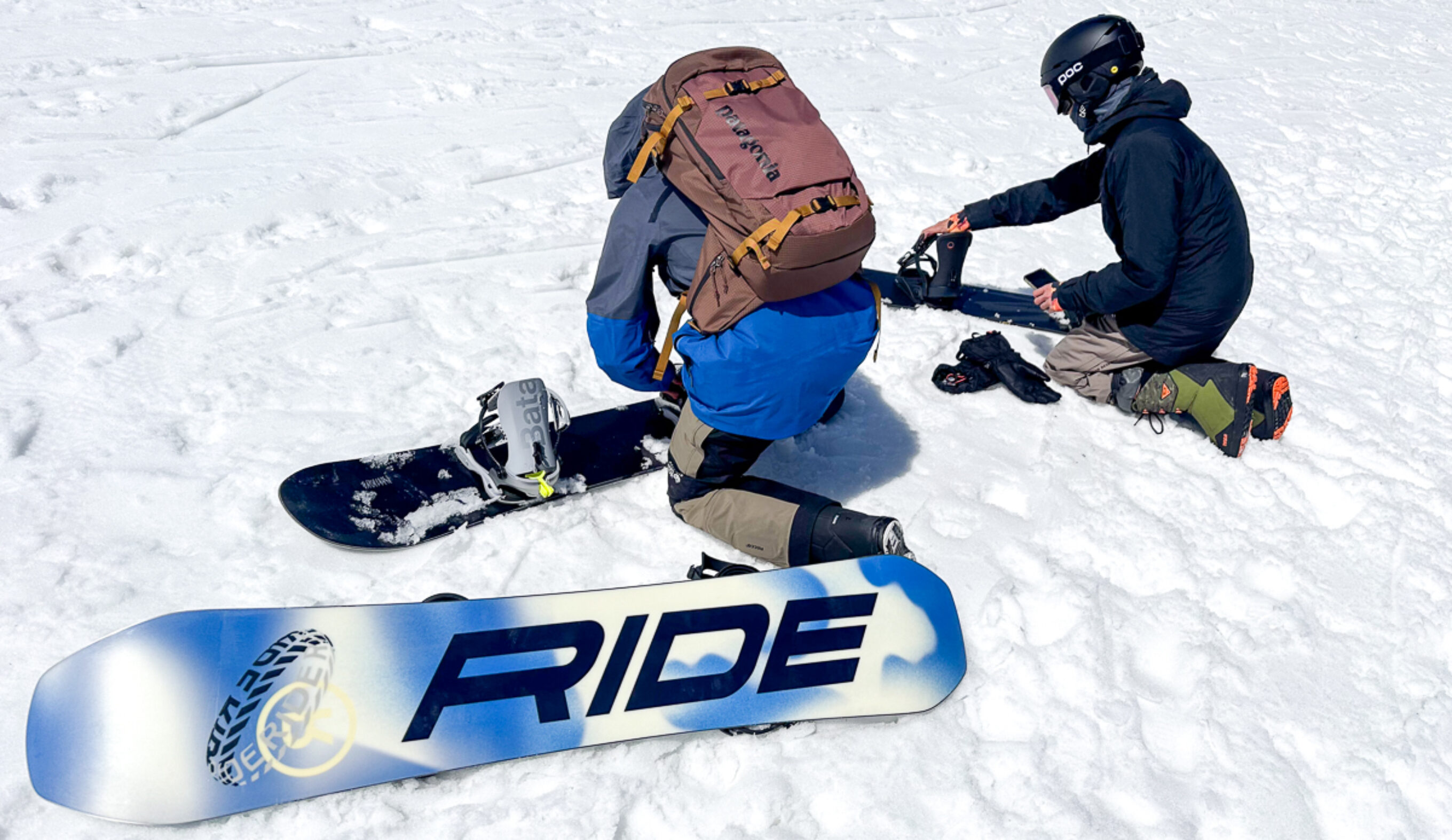 Two men with snowboards and bindings