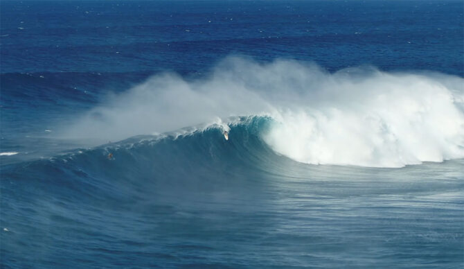 Albee Layer surfing Jaws wave during the first swell of the season