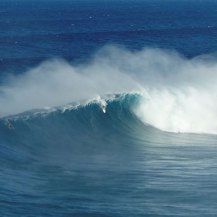 Albee Layer surfing Jaws wave during the first swell of the season