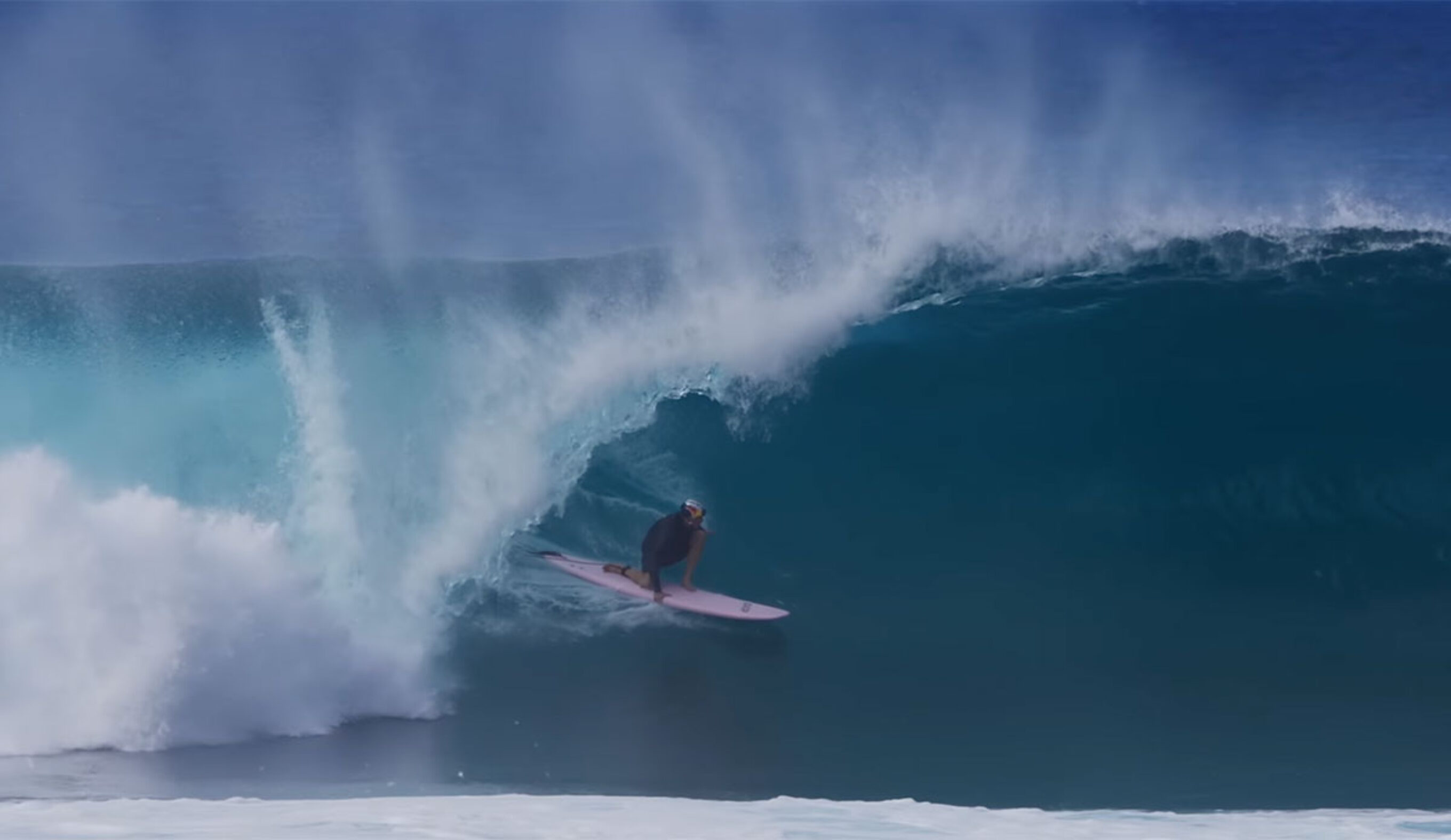 Jamie O'Brien surfing a Fun Day surfboard at Pipeline