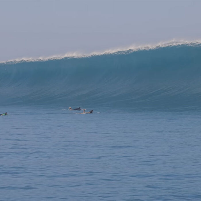 Koa Rothman and his friends paddling out to an outer reef in Hawaii to surf