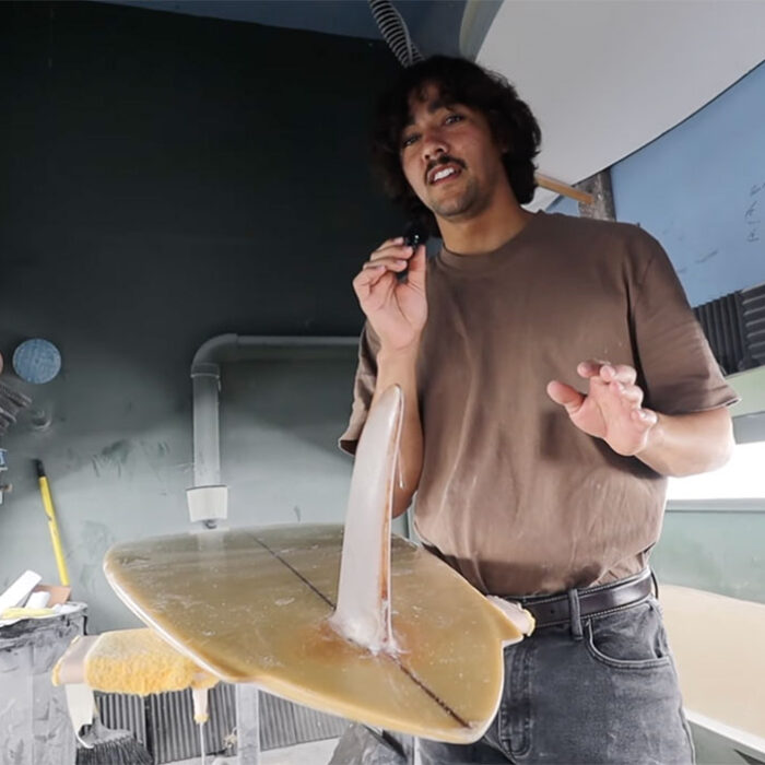 Zack Flores explaining how to shape a surfboard tail with a Steve Lis surfboard as an example