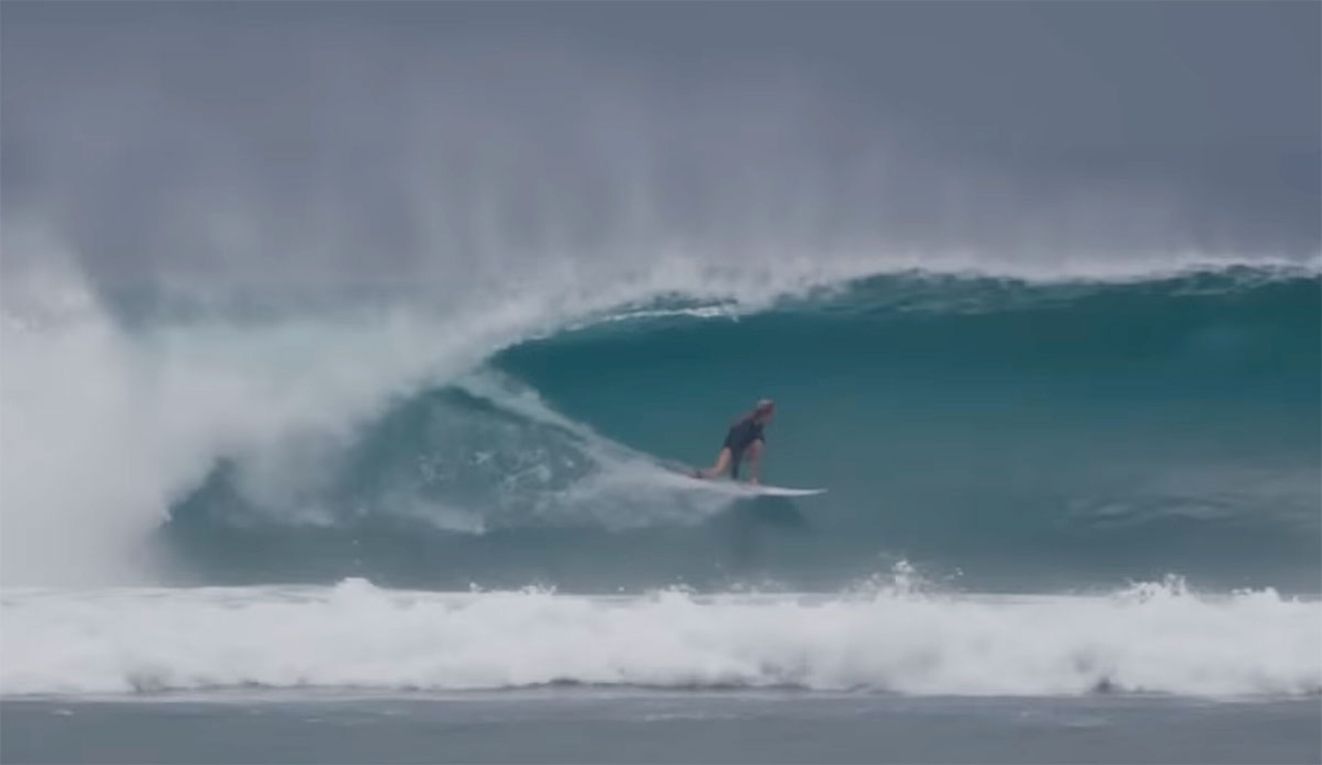 G-Land surfer riding a wave