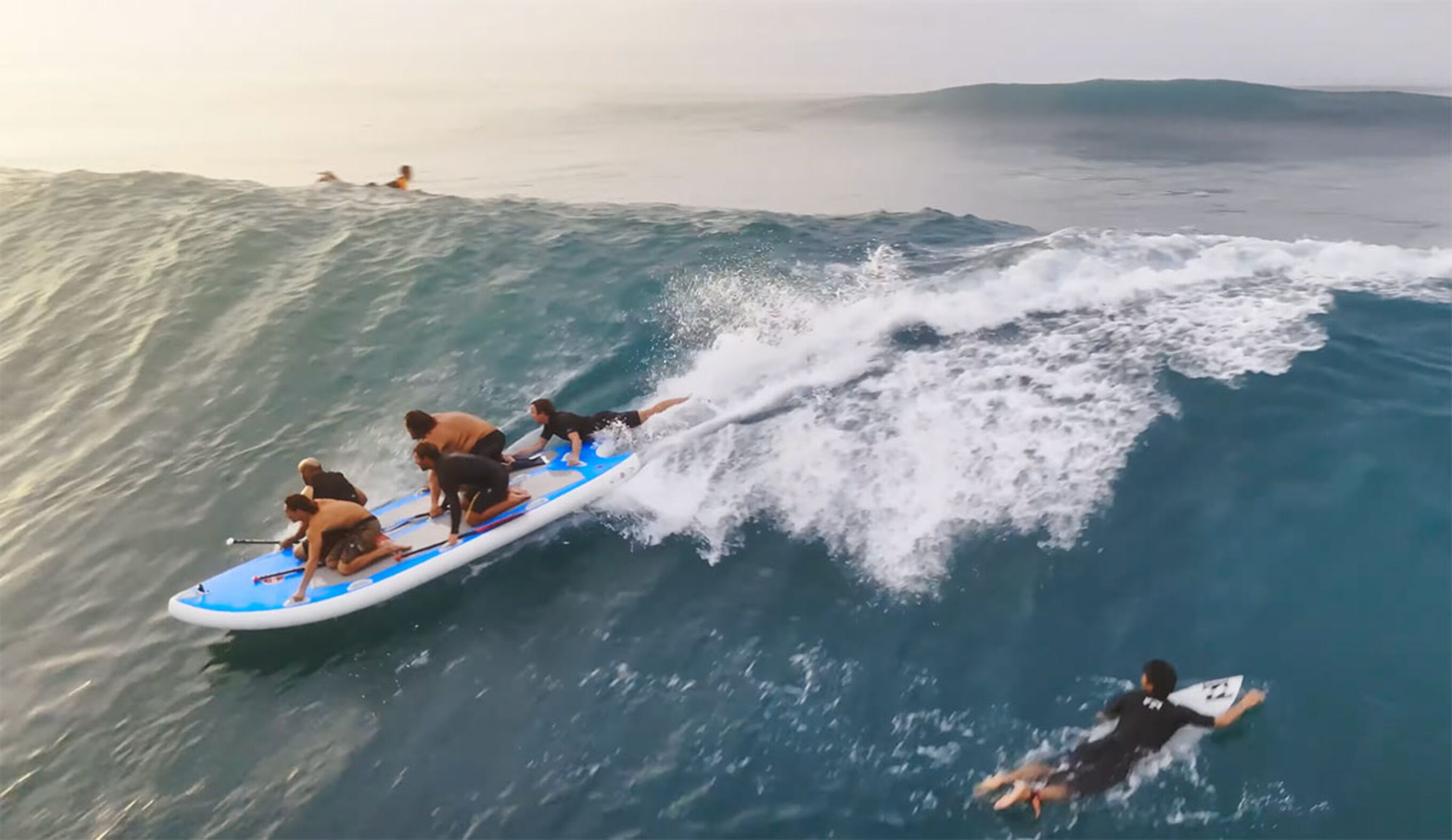 Jamie O'Brien steering a SUPsquatch at Sunset Beach