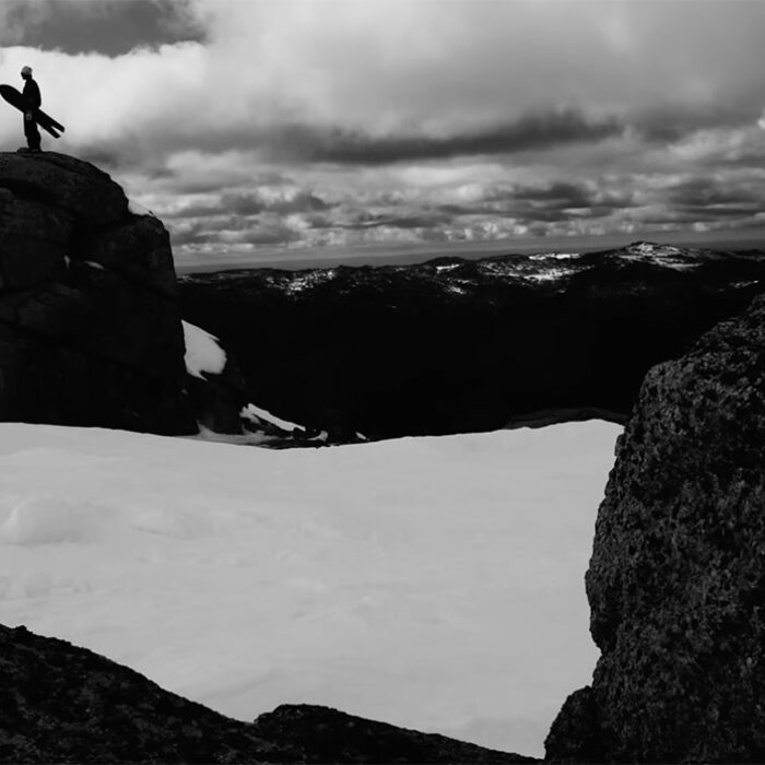 Man standing with Korua snowboard in Australia