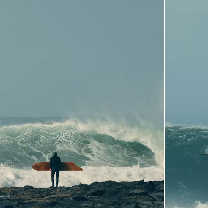 Remi Peterson standing at J-Bay with an alaia