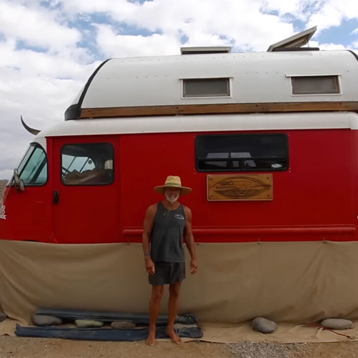 Glen Horn standing in front of his van in Baja