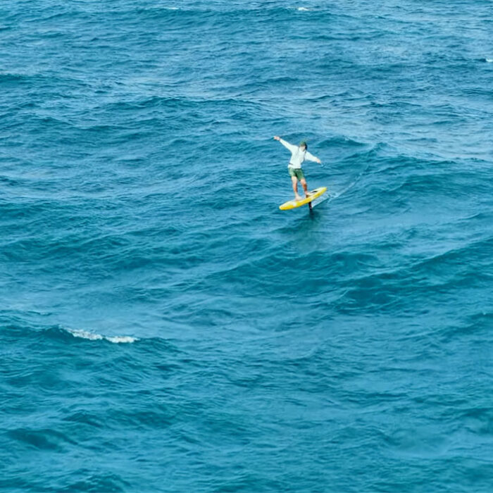 Josh Ku SUP hydrofoiling across the Bali Strait