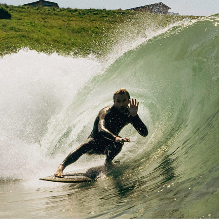 Lost Shore Surf Resort with a surfer