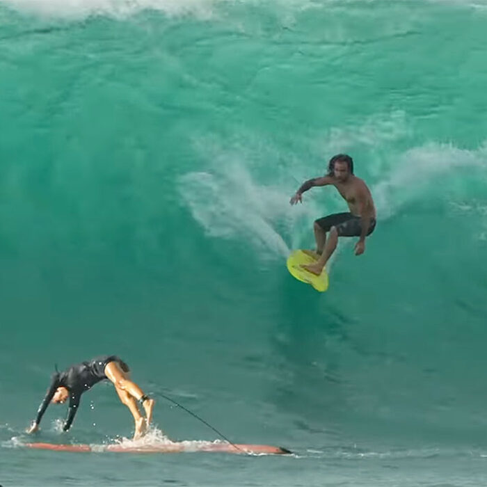 Mason Ho riding a small surfboard at Sunset Beach
