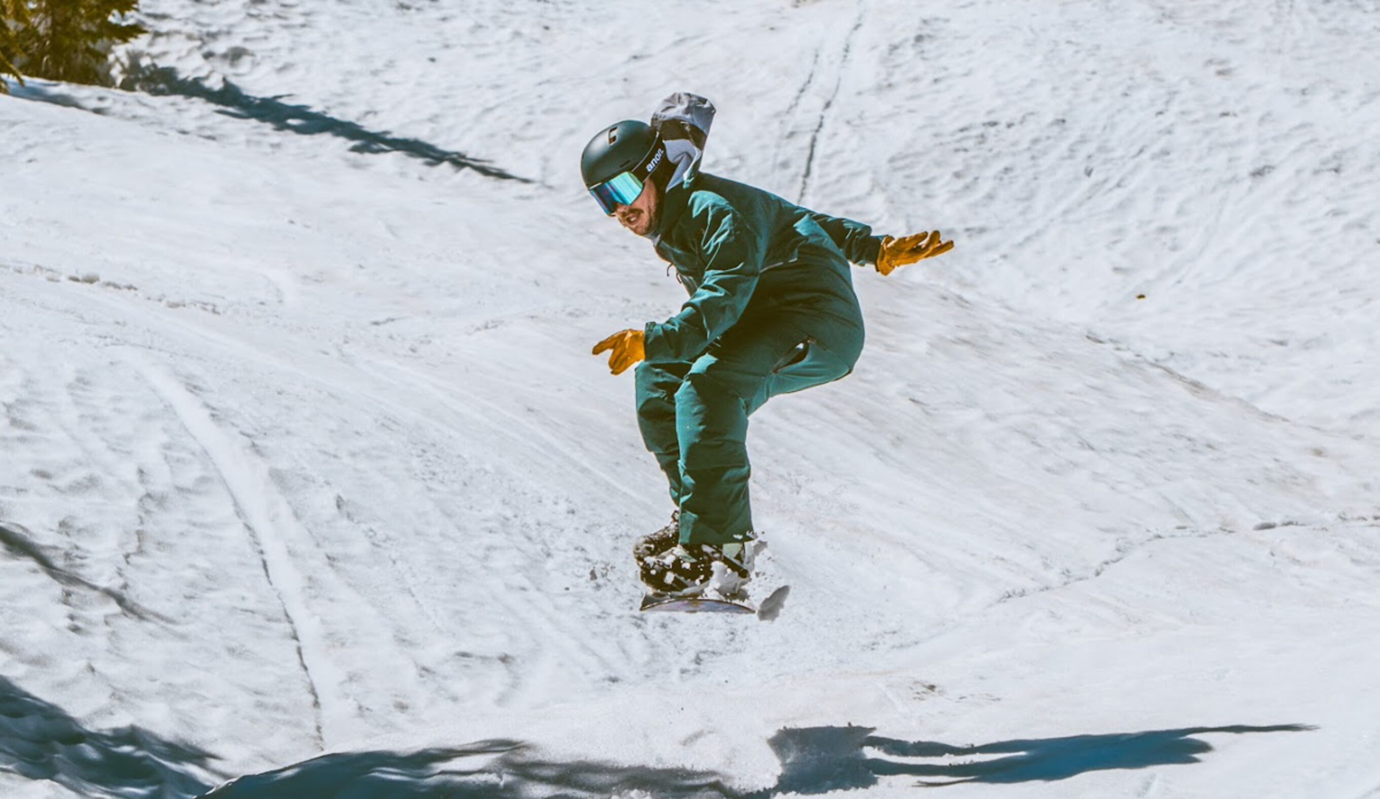 man jumping on snowboard
