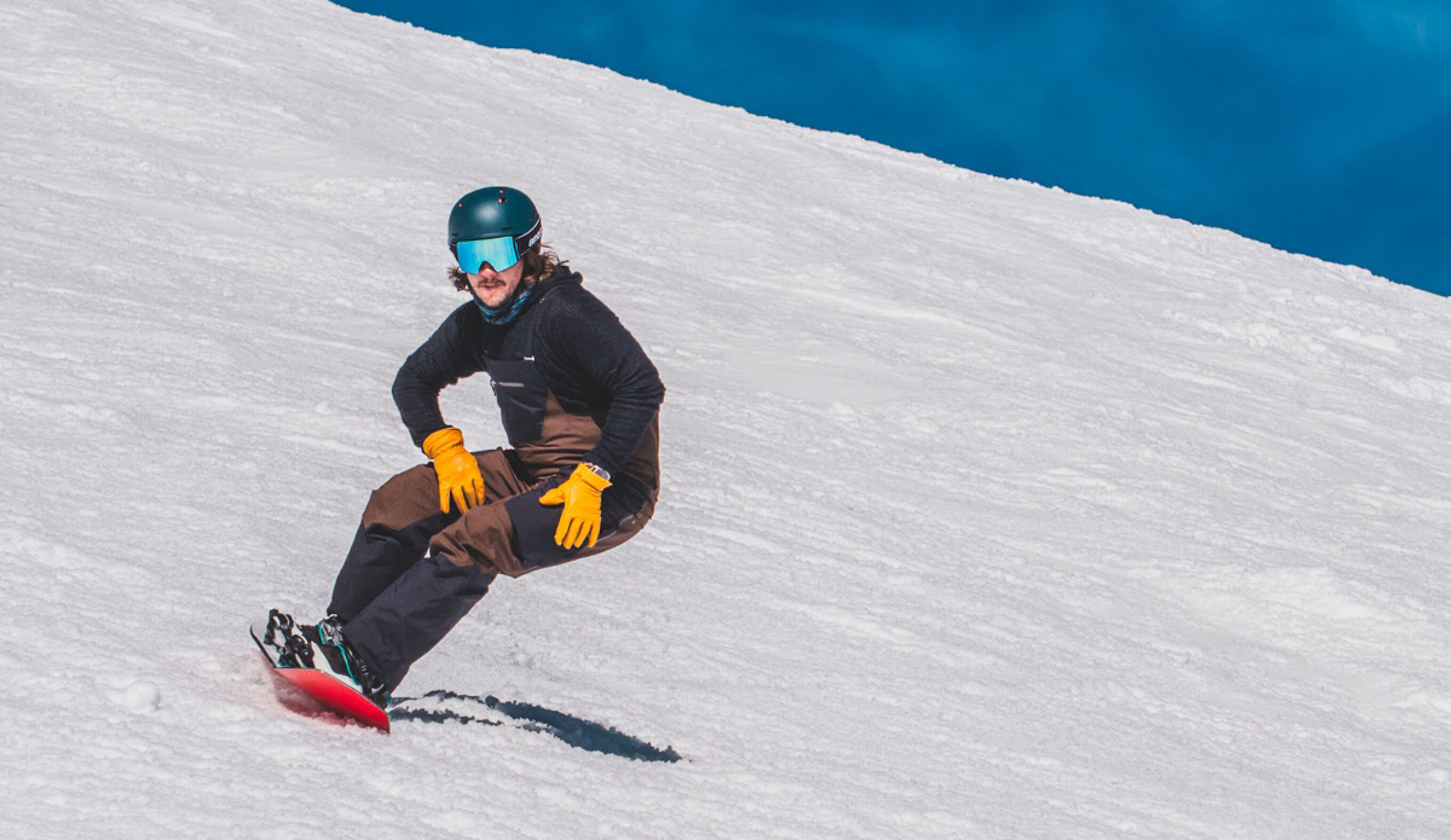 man turning heelside on snowboard