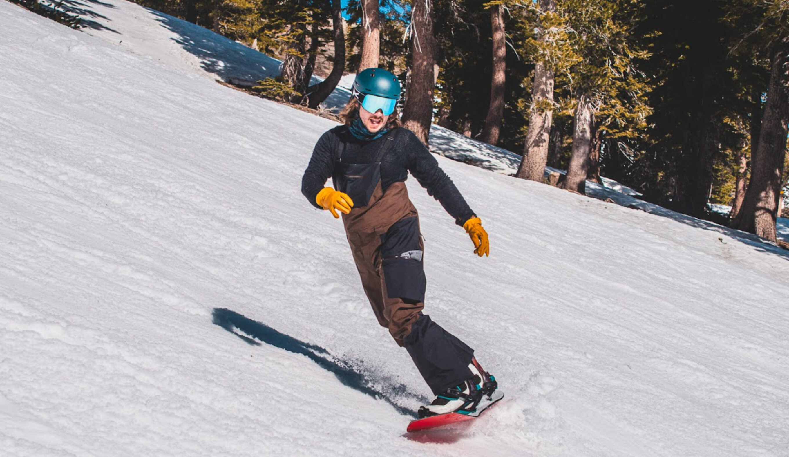 man riding snowboard