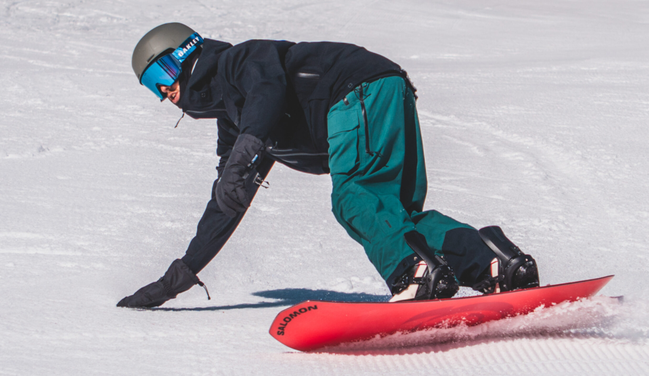Salomon board with oakley goggles and trew gear bibs