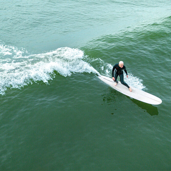 Danielle Cass surfing