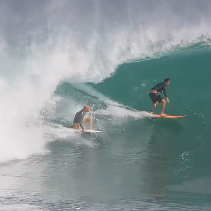 Kelly Slater surfing Uluwatu with a friend