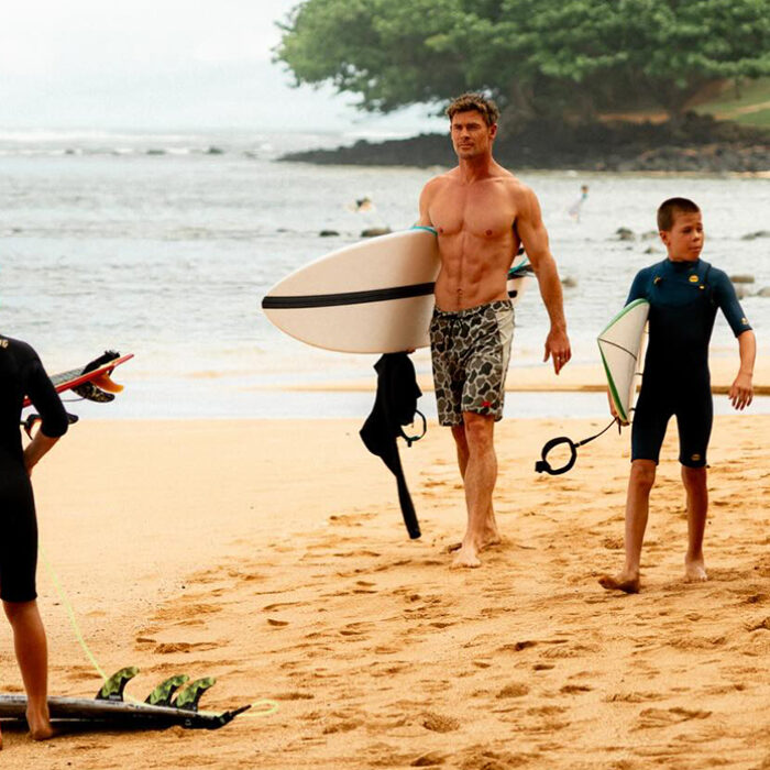 Chris Hemsworth herding a gaggle of groms in Hawaii. Photo: Chris Hemsworth // Instagram