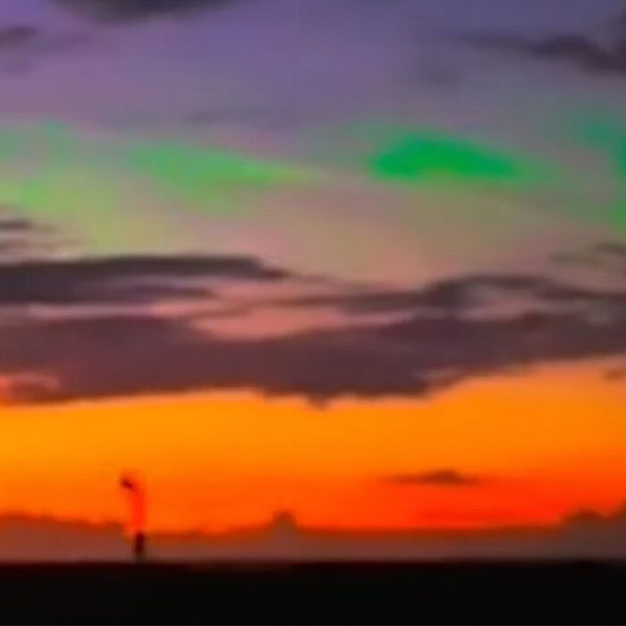 green lights in night sky over Kona, Hawaii