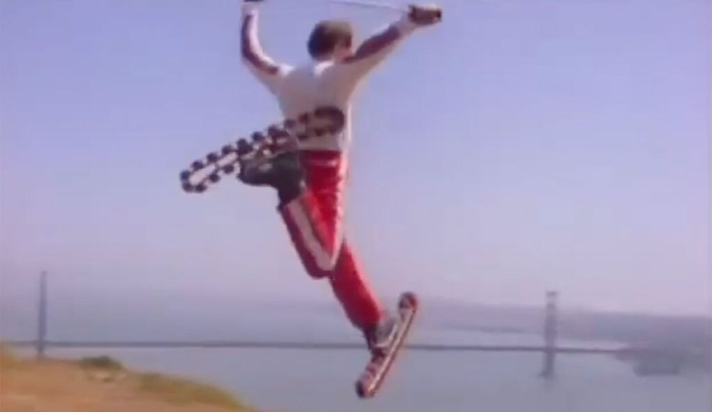 Man on rollerskis in front of the Golden Gate Bridge